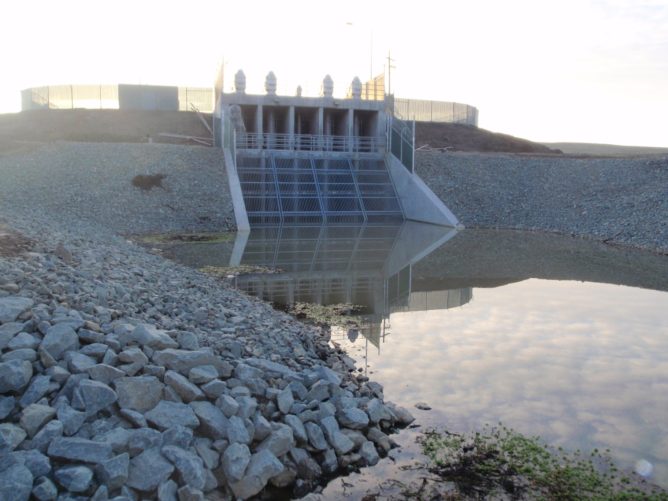 pumps around water surrounded by rocks