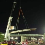 construction crane holding cement block