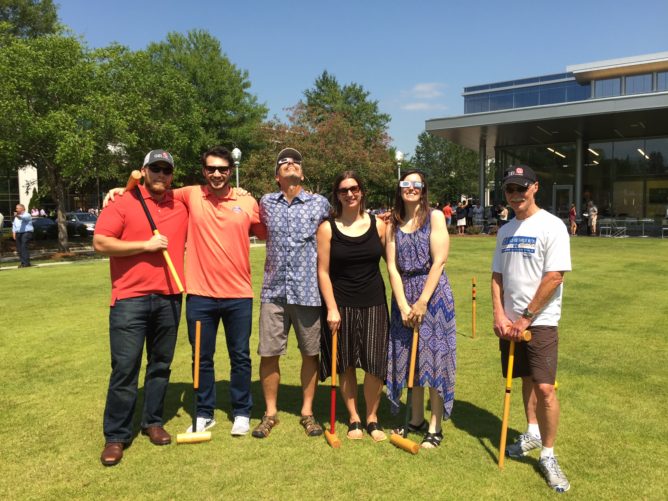 GEI employees with croquet sticks