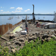 fenced off gas site along the water