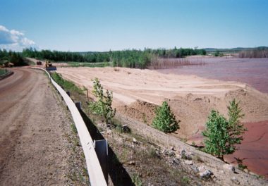 construction trucks flattening out dirt