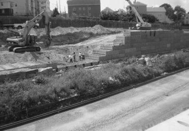 construction cranes working beside a road