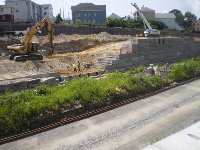 construction cranes working beside a road