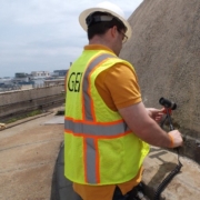 GEI worker in yellow vest working with concrete