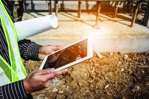 Tablet being held by consultant in field