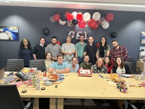 Kitchener Office Team Photo with Cake and Balloons