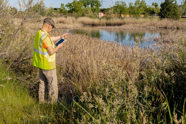 Man in hat surveying landscape