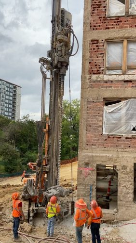 Heavy equipment working on foundations of building