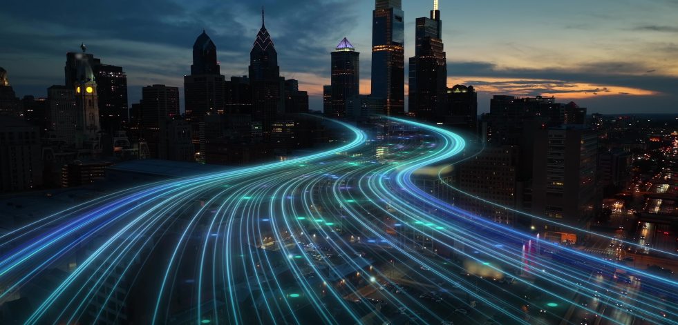 Image of digital lines heading into city's skyline