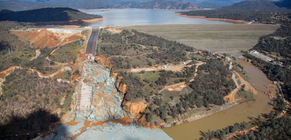 An aerial view of the damaged Oroville Dam spillway site and the huge debris field in the diversion pool just below the spillway.